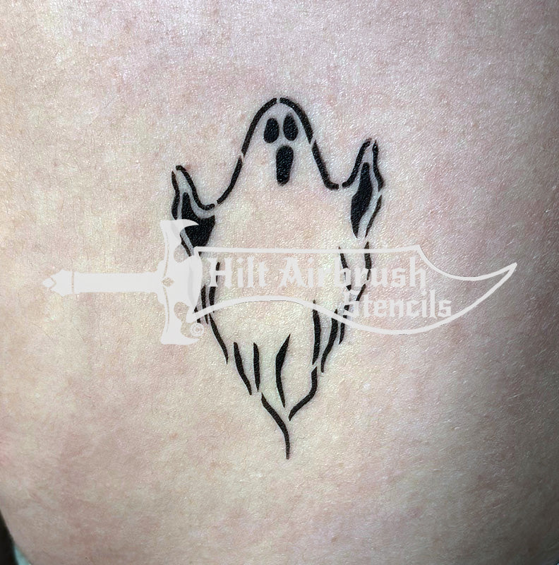 Ghost tattoo airbrushed on someone's arm created with a Hilt Airbrush Stencil