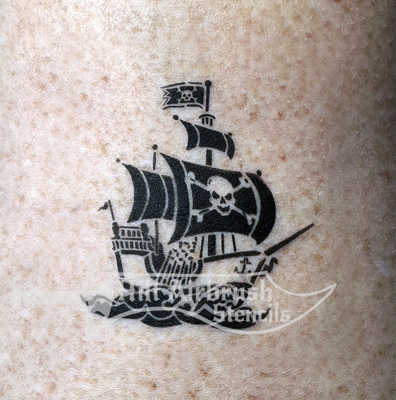 Pirate ship tattoo airbrushed on someone with skull and crossbones flag.