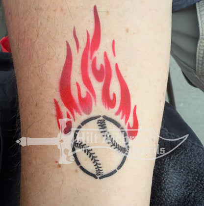 A temporary airbrush tattoo, featuring a baseball with flames trailing behind it.