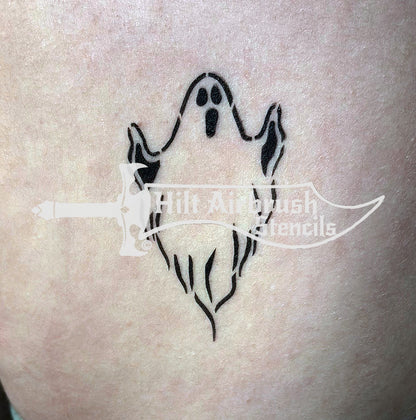 Ghost tattoo airbrushed on someone's arm created with a Hilt Airbrush Stencil
