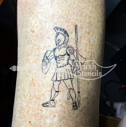 A temporary tattoo of a Spartan warrior holding a spear and shield.