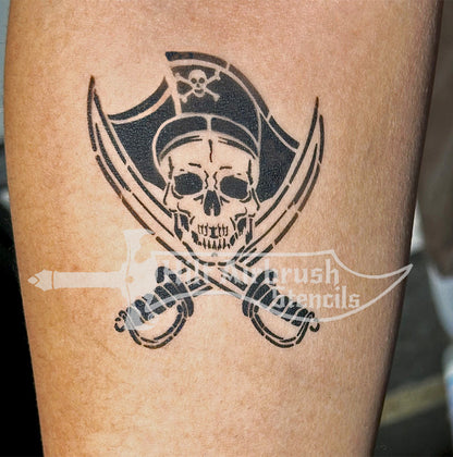 Jolly Rodger Pirate skull and swords tattoo airbrushed on a person's arm created by Hilt Airbrush Stencils..