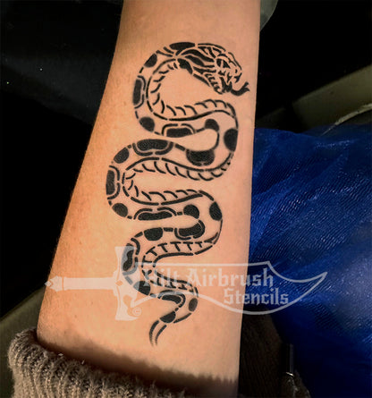 Patterned Snake design airbrushed on a person's arm from Hilt Airbrush Stencils store.