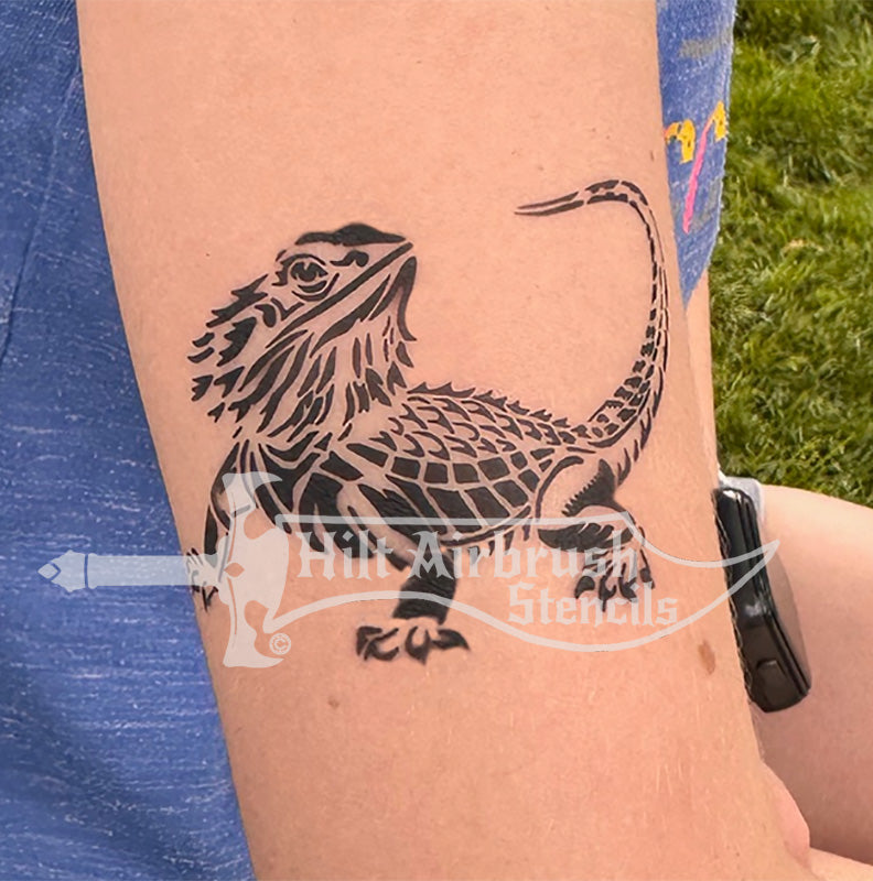 Bearded Lizard tattoo airbrushed on a person's arm using a Hilt Airbrush Tattoo Stencil.