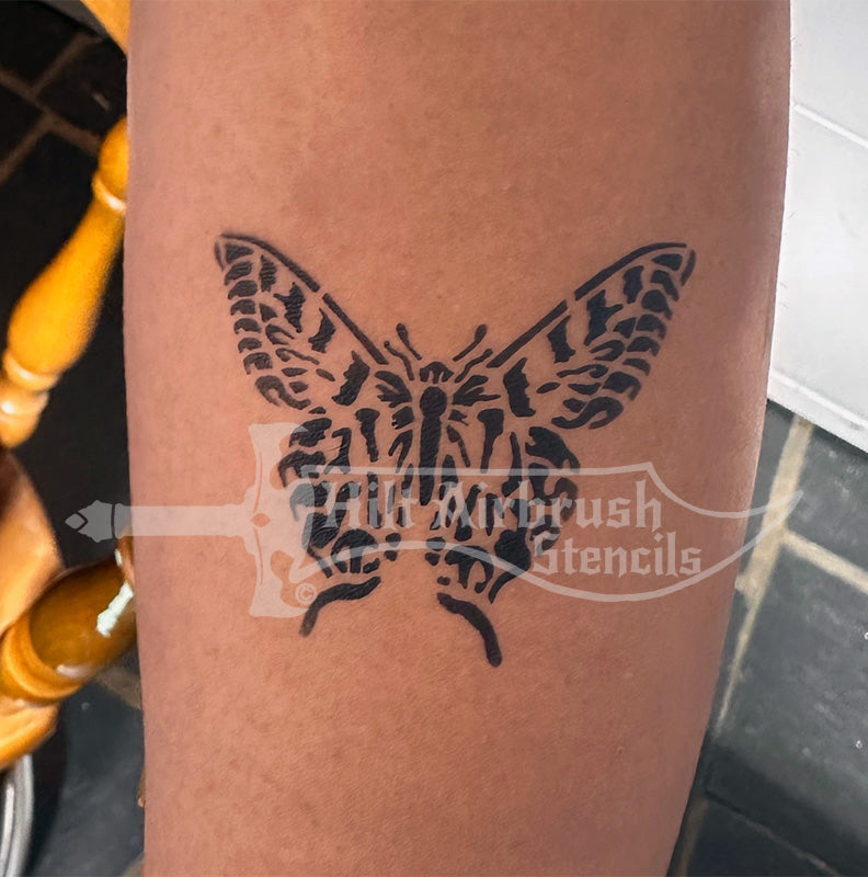 Butterfly airbrush tattoo sprayed on a person's arm designed by Hilt Airbrush Tattoo Stencils.