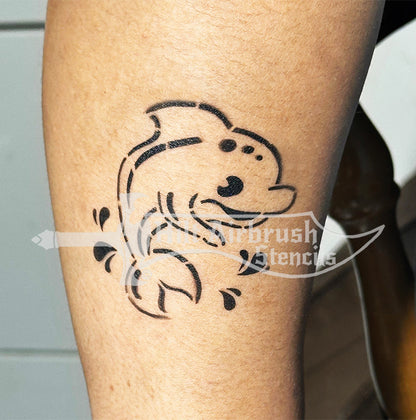 Tattoo of a children's airbrush design sprayed on a child's arm created with a Hilt Airbrush stencil.