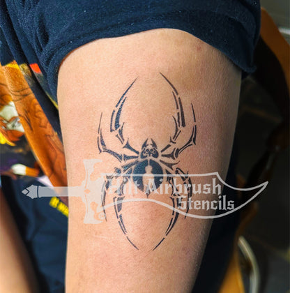 Spider tattoo airbrushed on a person's arm created with a Hilt Airbrush Tattoos stencil.