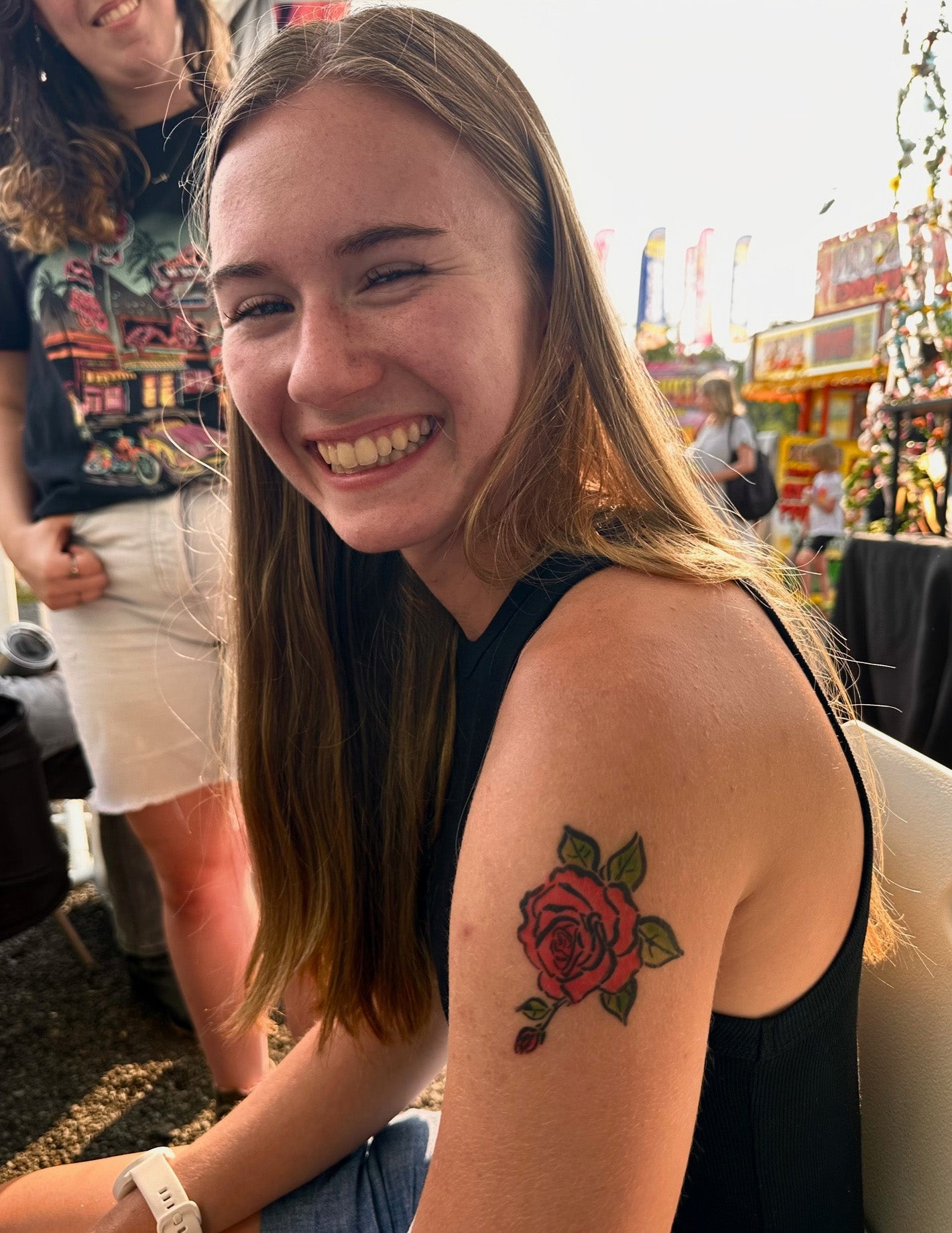 Girl with a rose airbrush tattoo created by a Hilt Airbrush Stencil.