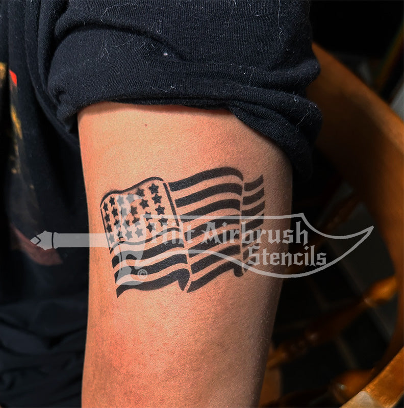 American flag airbrush tattoo stenciled on a person's arm from Hilt Airbrush Stencils.